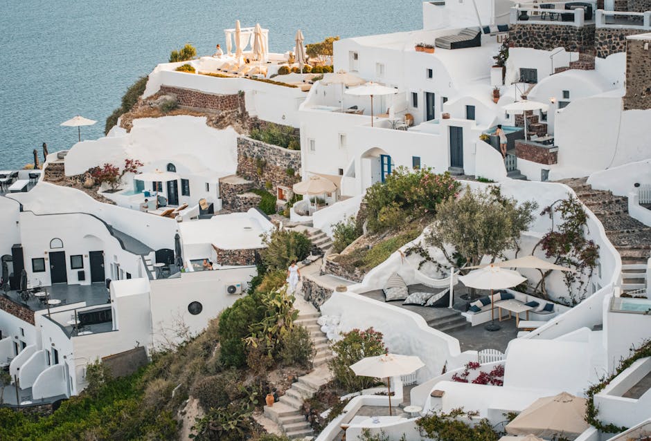 A breathtaking view of Fira's iconic white buildings and the Aegean Sea in Santorini
