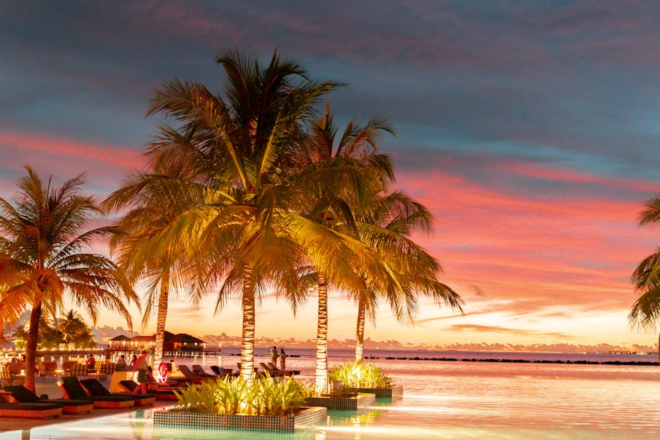 Experience ultimate relaxation at a tropical resort paradise during a breathtaking sunset